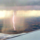 Illustration for article titled Airplane passenger captures cool shot of lightning striking the ground